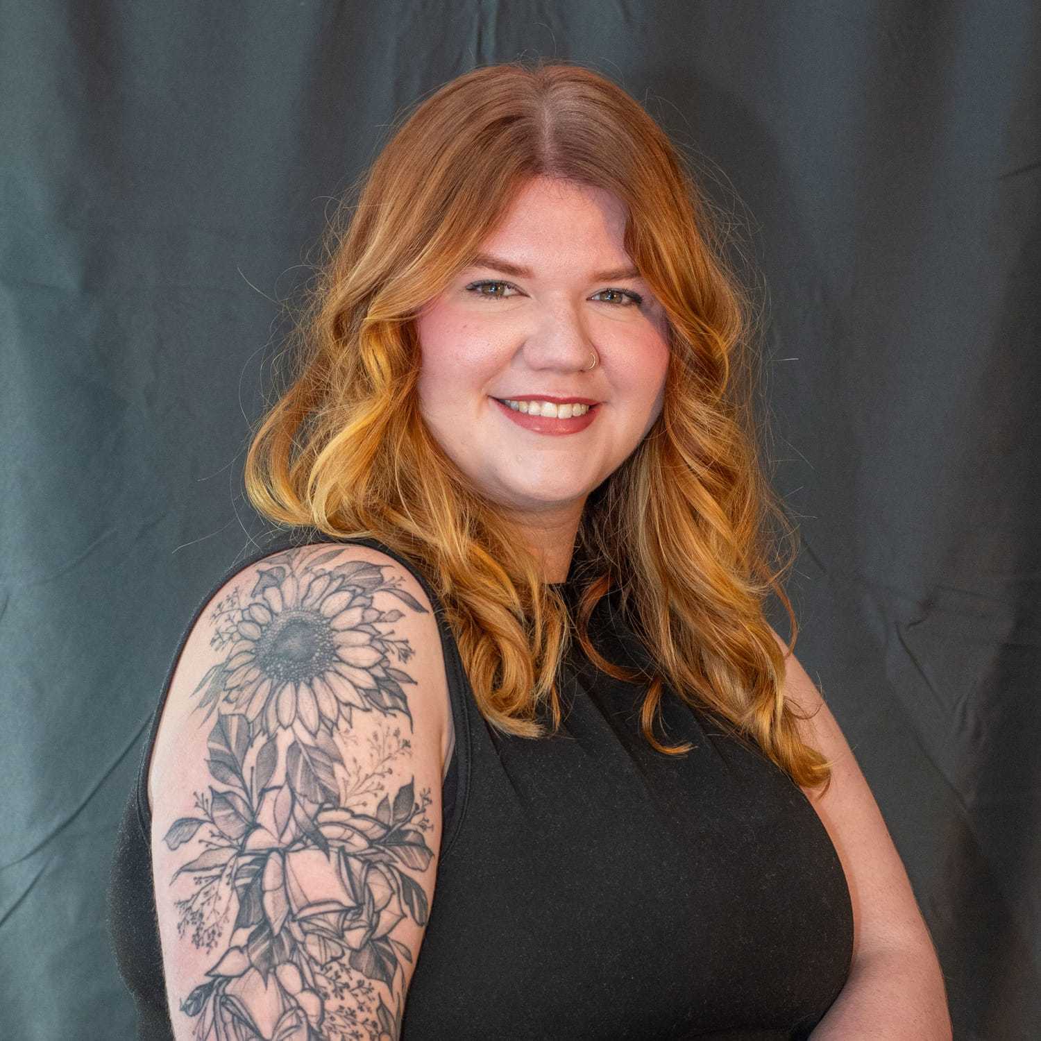 Portrait of Cayla Kidd, a professional stylist at Salon L Manayunk, showcasing their expertise and style.