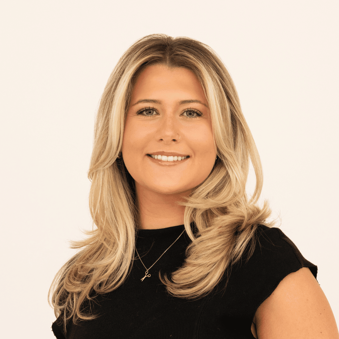 Portrait of Natalie Banff, a professional stylist at Salon L Manayunk, showcasing their expertise and style.