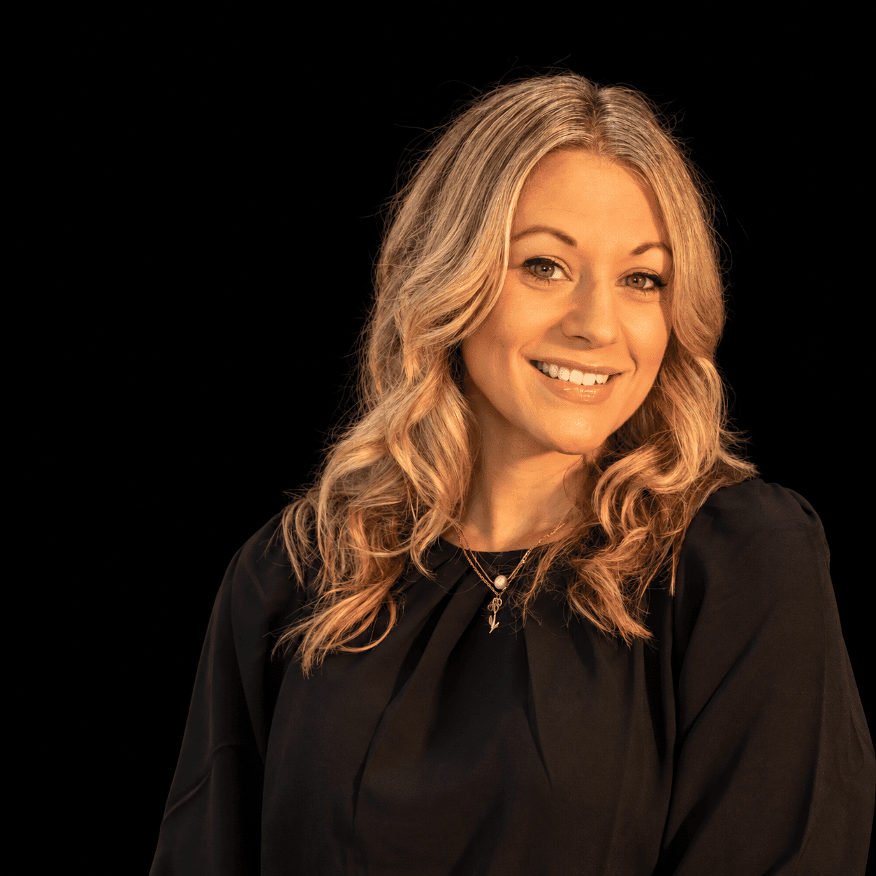 Portrait of Nancy Babcock, a professional stylist at Salon L Manayunk, showcasing their expertise and style.