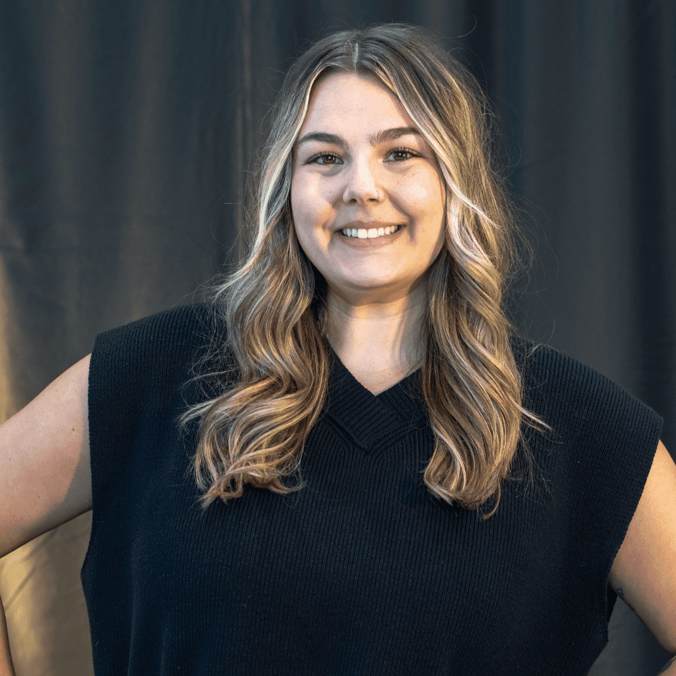 Portrait of Lauren Valletta, a professional stylist at Salon L Manayunk, showcasing their expertise and style.