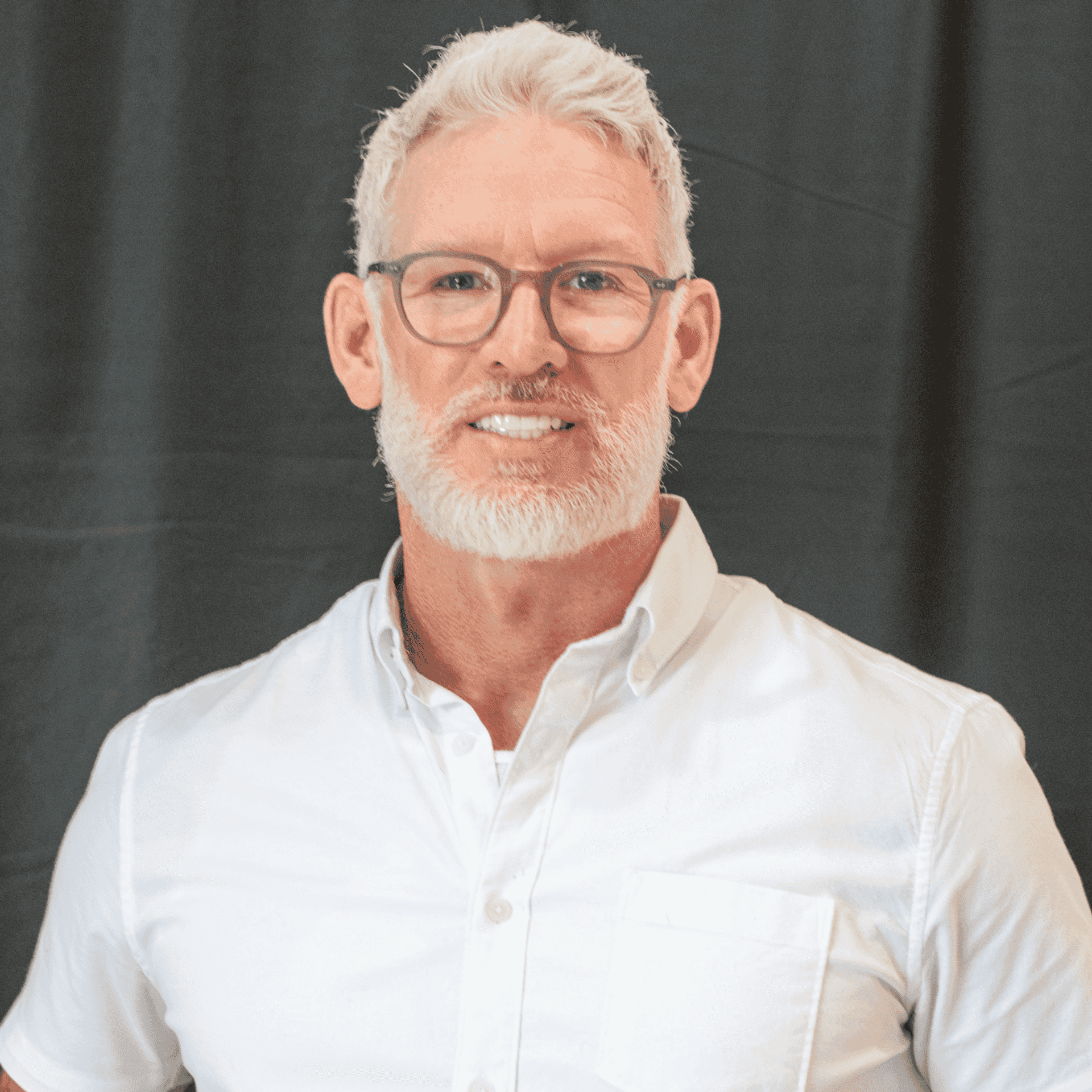 Portrait of Michael O’Connor, a professional stylist at Salon L Manayunk, showcasing their expertise and style.