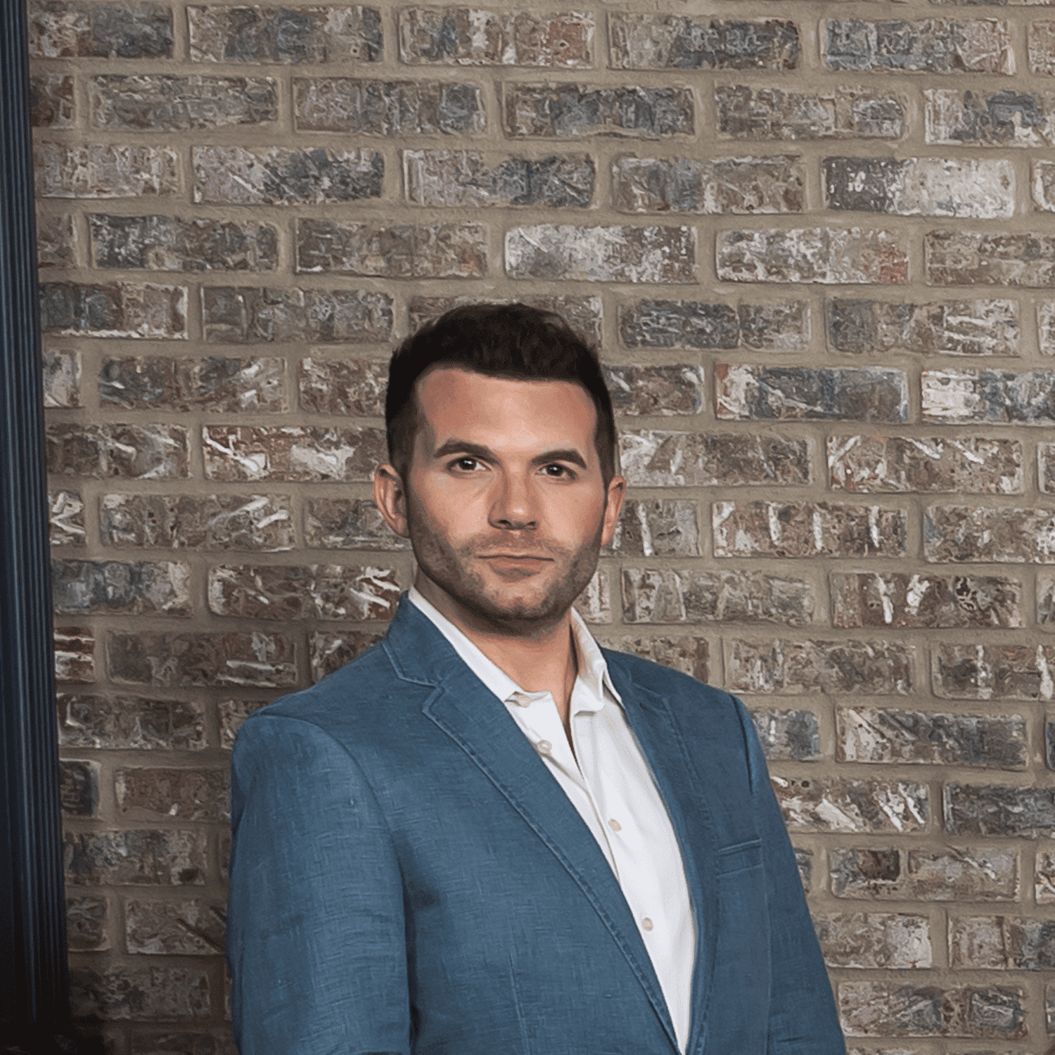 Portrait of Michael Garrity, a professional stylist at Salon L Manayunk, showcasing their expertise and style.